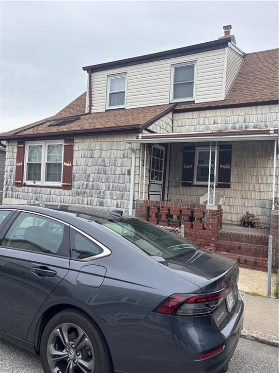 37 Celeste Ct, Brooklyn, NY 11229 - view of front of house featuring covered porch and roof with shingles