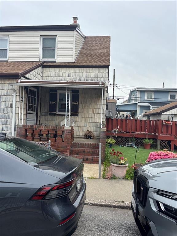 37 Celeste Ct, Brooklyn, NY 11229 - view of front of home featuring a porch and a shingled roof