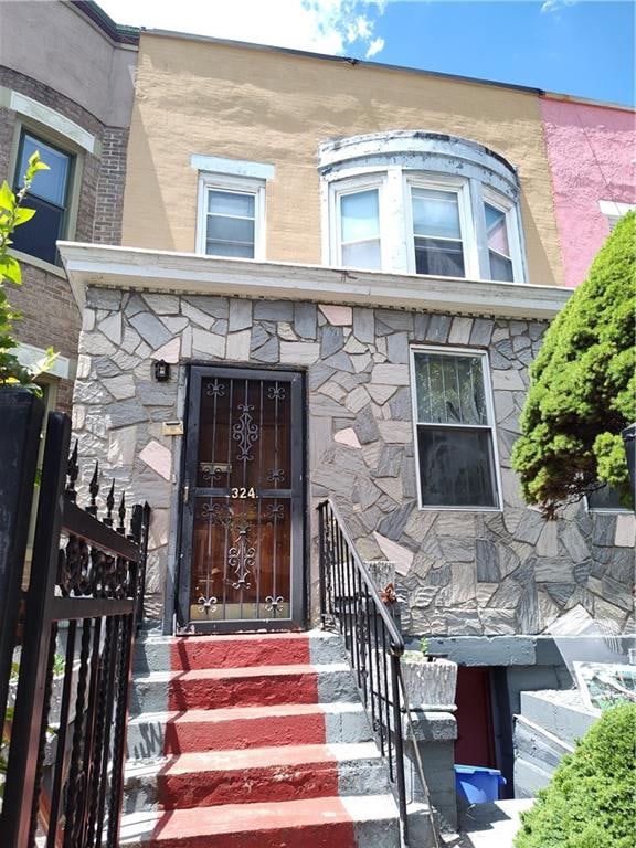 324 E 26th St, Brooklyn, NY 11226 - doorway to property with stone siding