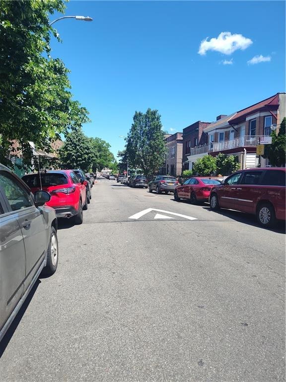 324 E 26th St, Brooklyn, NY 11226 - view of asphalt road with street lights and a residential view