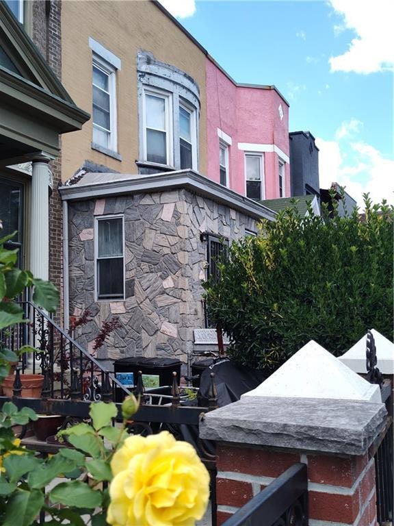 324 E 26th St, Brooklyn, NY 11226 - view of side of home with stone siding
