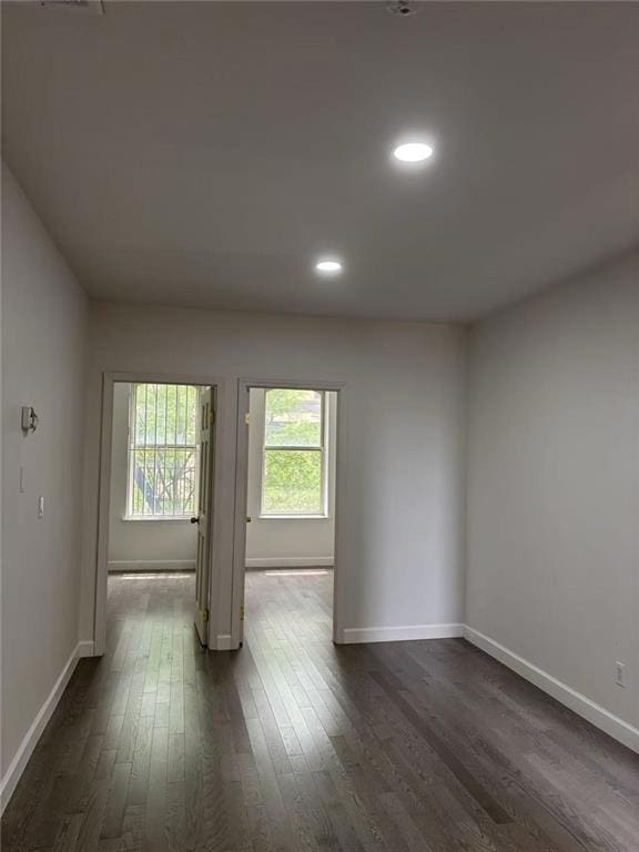 555 W 149th St Unit 4, New York, NY 10031 - spare room with dark wood-style flooring, baseboards, and recessed lighting
