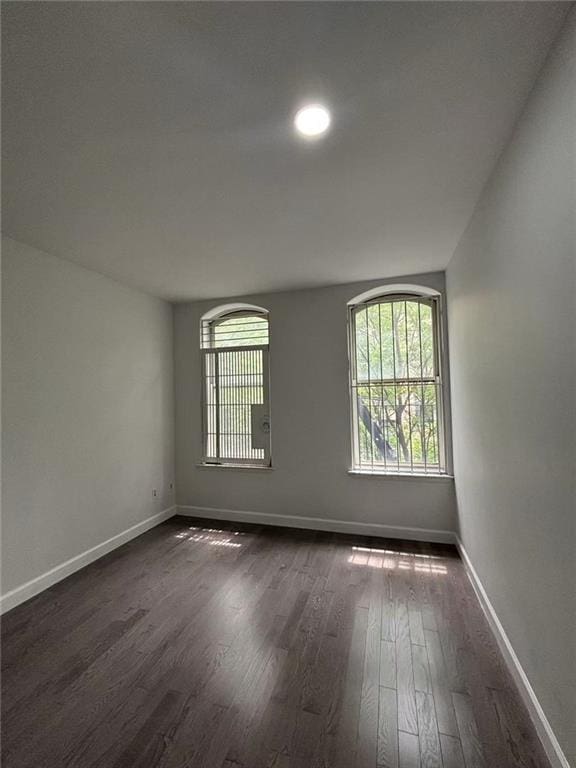 555 W 149th St Unit 4, New York, NY 10031 - unfurnished room with dark wood-style flooring and recessed lighting