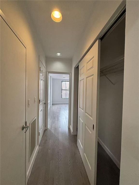 555 W 149th St Unit 4, New York, NY 10031 - hallway featuring dark wood-style floors, recessed lighting, and baseboards
