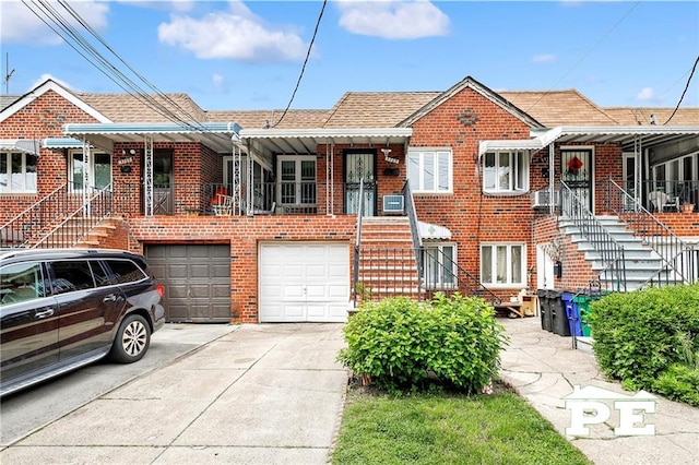5709 Fillmore Ave, Brooklyn, NY 11234 - view of front of house with driveway, brick siding, and an attached garage