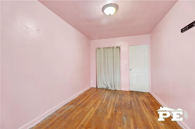 5709 Fillmore Ave, Brooklyn, NY 11234 - unfurnished bedroom with hardwood / wood-style floors and baseboards