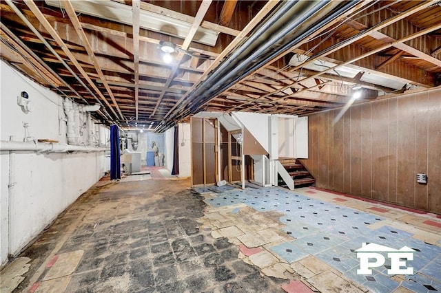 5709 Fillmore Ave, Brooklyn, NY 11234 - unfinished basement with stairs and wooden walls