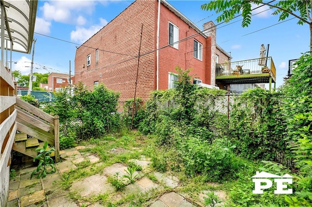 5709 Fillmore Ave, Brooklyn, NY 11234 - view of property exterior with brick siding and a chimney