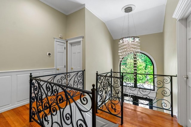 476 Hargold Ave, Staten Island, NY 10309 - staircase with a chandelier, wood finished floors, wainscoting, and crown molding