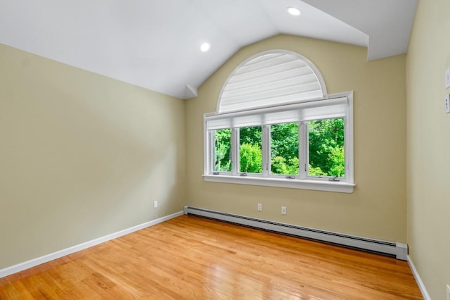 476 Hargold Ave, Staten Island, NY 10309 - unfurnished room featuring baseboard heating, lofted ceiling, wood finished floors, recessed lighting, and baseboards