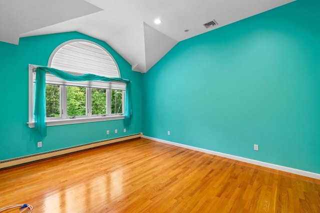 476 Hargold Ave, Staten Island, NY 10309 - empty room featuring lofted ceiling, wood finished floors, a baseboard heating unit, baseboards, and recessed lighting
