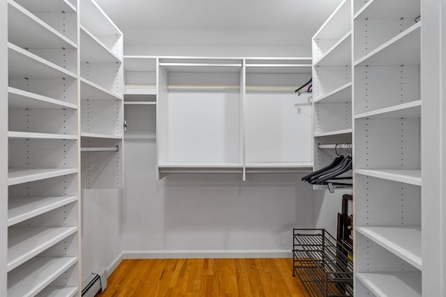 476 Hargold Ave, Staten Island, NY 10309 - walk in closet with wood finished floors and a baseboard heating unit