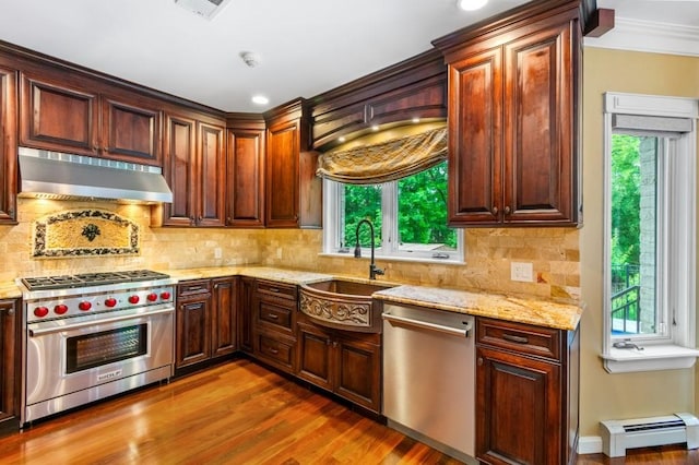 476 Hargold Ave, Staten Island, NY 10309 - kitchen with appliances with stainless steel finishes, exhaust hood, a sink, a baseboard heating unit, and healthy amount of natural light