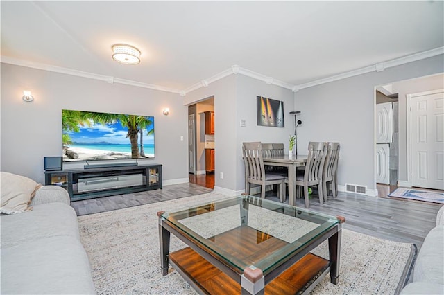 39 Morton St, Staten Island, NY 10306 - living room with wood finished floors, crown molding, and baseboards