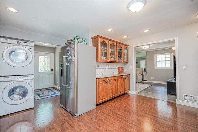 39 Morton St, Staten Island, NY 10306 - washroom with stacked washer / drying machine, wood finished floors, baseboards, and recessed lighting