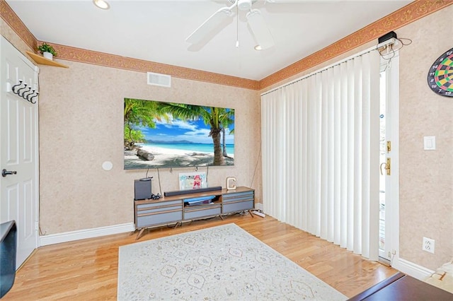 39 Morton St, Staten Island, NY 10306 - living area featuring wood finished floors, ceiling fan, wallpapered walls, and baseboards