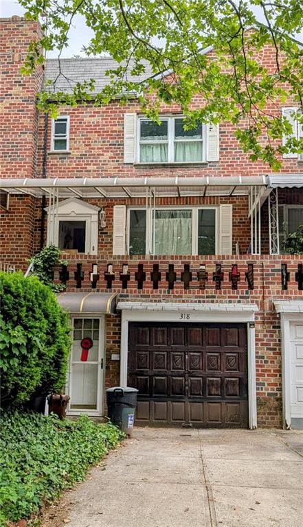 318 Bay 11th St, Brooklyn, NY 11228 - multi unit property with concrete driveway, brick siding, and an attached garage