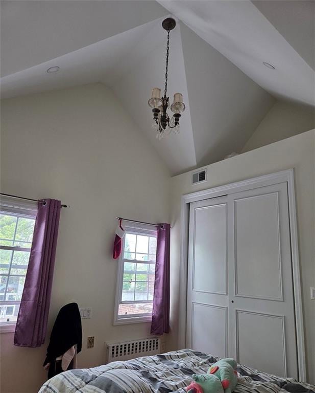 1711 E 36th St, Brooklyn, NY 11234 - bedroom with radiator heating unit, a chandelier, a closet, and high vaulted ceiling