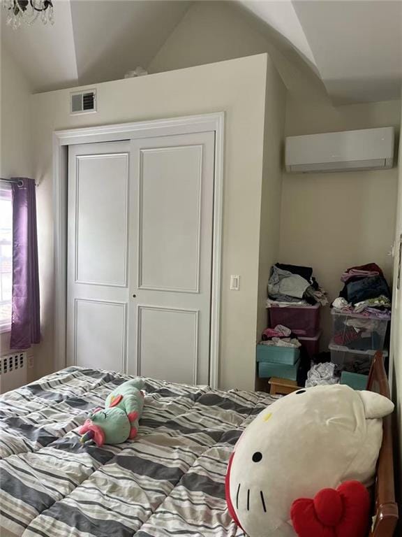 1711 E 36th St, Brooklyn, NY 11234 - bedroom featuring a closet, a wall unit AC, lofted ceiling, and radiator