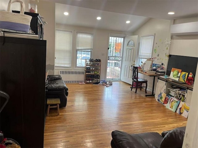 1711 E 36th St, Brooklyn, NY 11234 - living area featuring radiator, hardwood / wood-style floors, lofted ceiling, and recessed lighting
