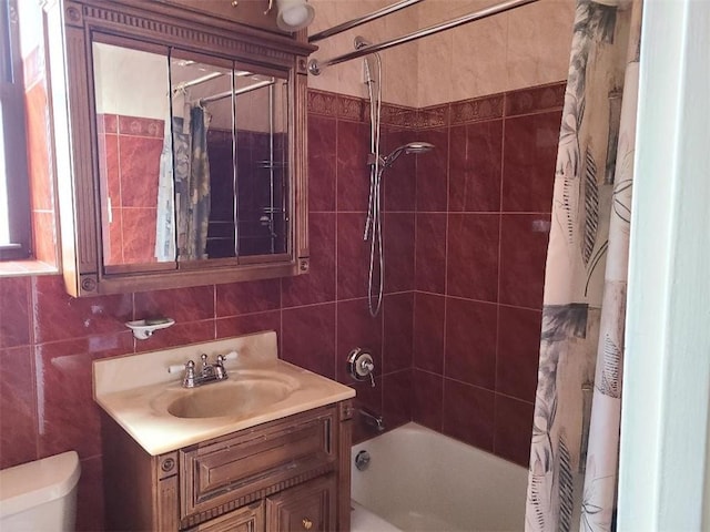 1811 Ocean Pkwy Unit 6-L, Brooklyn, NY 11223 - full bathroom featuring tile walls, vanity, shower / bath combo with shower curtain, and toilet