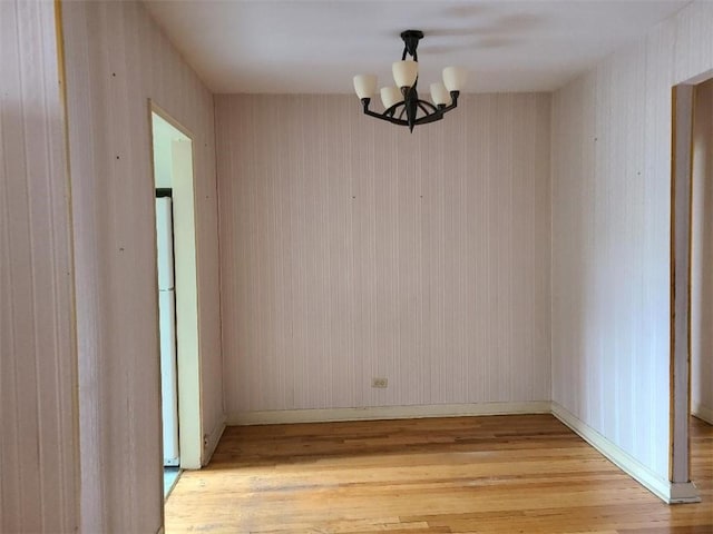 1811 Ocean Pkwy Unit 6-L, Brooklyn, NY 11223 - unfurnished dining area with light wood finished floors, a chandelier, and baseboards