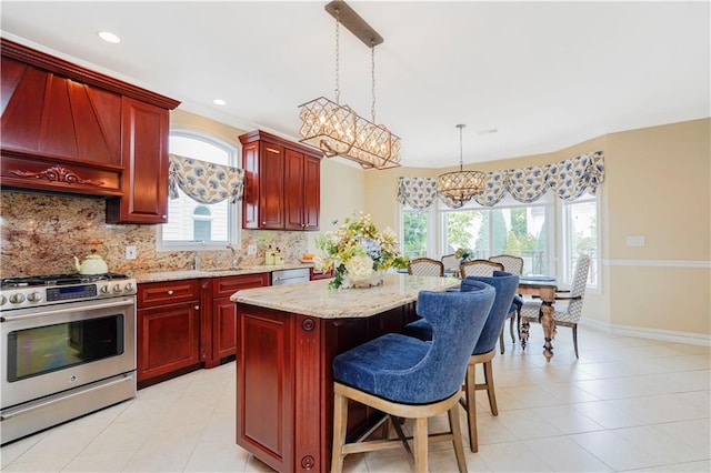 237 Swinnerton St, Staten Island, NY 10307 - kitchen featuring stainless steel appliances, reddish brown cabinets, a chandelier, backsplash, and recessed lighting
