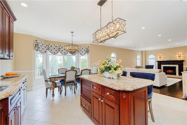 237 Swinnerton St, Staten Island, NY 10307 - kitchen featuring light tile patterned floors, recessed lighting, a chandelier, reddish brown cabinets, and hanging light fixtures