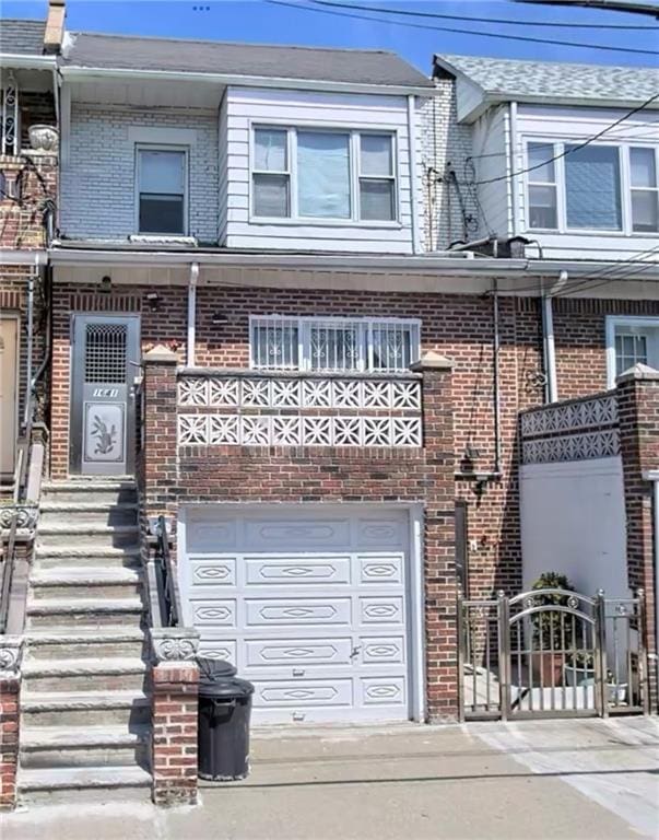 1641 82nd St, Brooklyn, NY 11214 - multi unit property with brick siding, a gate, and a garage