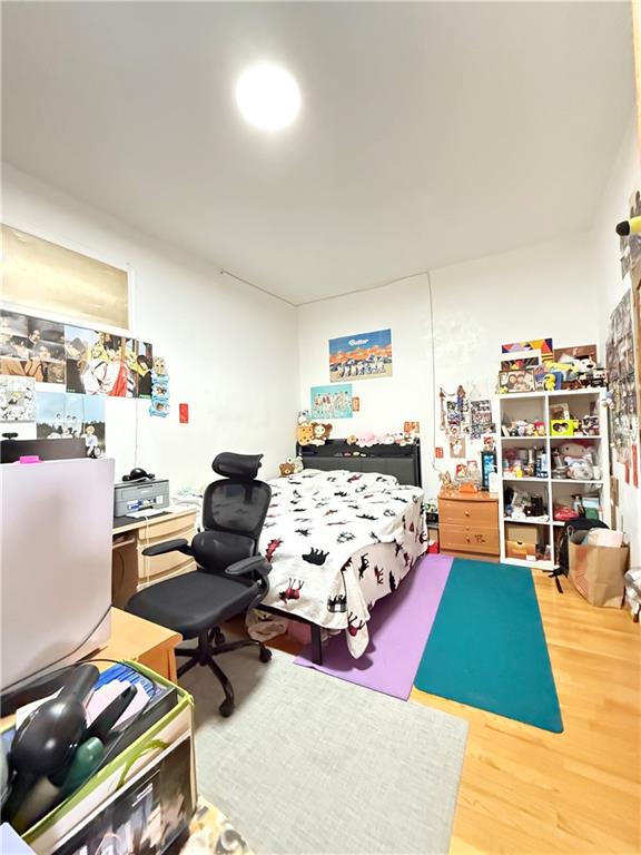 1641 82nd St, Brooklyn, NY 11214 - bedroom with wood finished floors and an office area