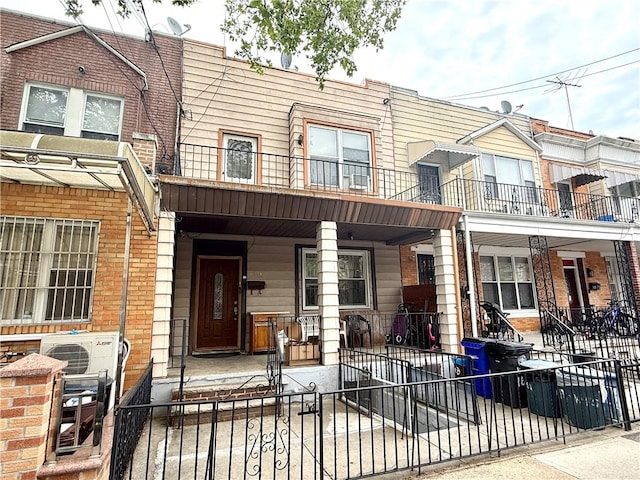 1871 W 8th St, Brooklyn, NY 11223 - multi unit property with a porch, a fenced front yard, and ac unit