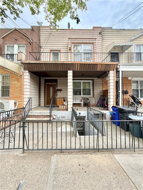 1871 W 8th St, Brooklyn, NY 11223 - multi unit property with a porch, a fenced front yard, a cooling unit, and a balcony