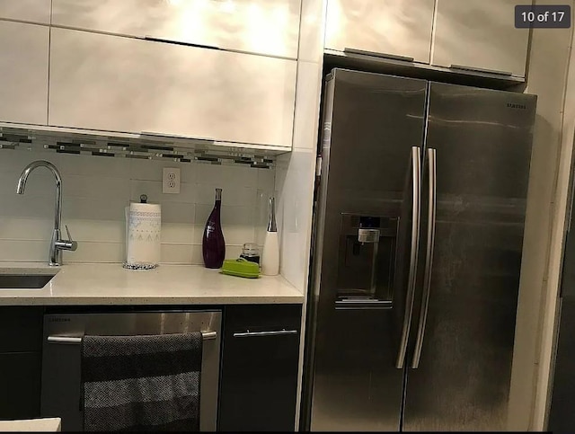 1440 Midland Ave Unit 1D, Bronxville, NY 10108 - kitchen with stainless steel refrigerator with ice dispenser, beverage cooler, modern cabinets, tasteful backsplash, and a sink
