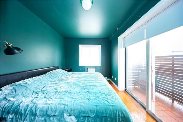 2543 W 16th St Unit C2, Brooklyn, NY 11214 - bedroom with light wood-style flooring and vaulted ceiling