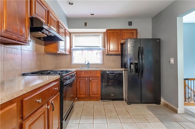 27 Bascom Pl, Staten Island, NY 10314 - kitchen featuring black appliances, extractor fan, a sink, light countertops, and decorative backsplash