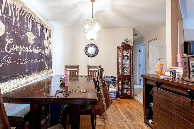 27 Bascom Pl, Staten Island, NY 10314 - dining area featuring a chandelier and wood finished floors