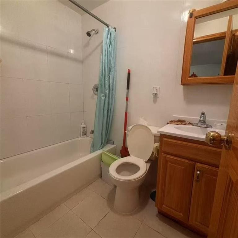 864 56th St Unit 2C, Brooklyn, NY 11220 - full bath featuring toilet, shower / bathtub combination with curtain, vanity, and tile patterned floors