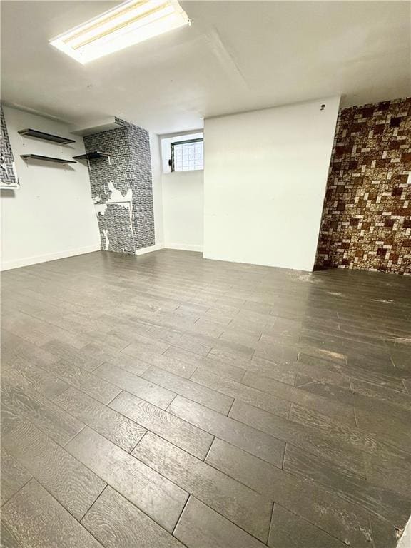 133 Quentin Rd, Brooklyn, NY 11223 - basement featuring brick wall and wood finished floors