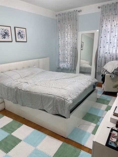 601 Brightwater Ct Unit 3I, Brooklyn, NY 11235 - bedroom featuring wood finished floors