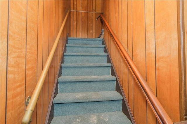 660 85th St, Brooklyn, NY 11228 - staircase featuring carpet floors and wood walls