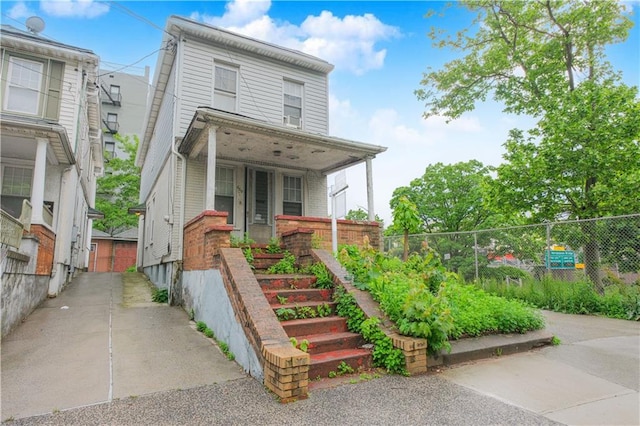 660 85th St, Brooklyn, NY 11228 - view of front facade with covered porch and brick siding