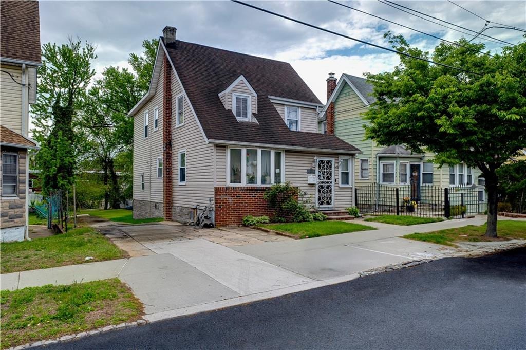 193-32 Williamson Ave, Queens Springfield Gdns, NY 11413 - view of front of home with a chimney and roof with shingles