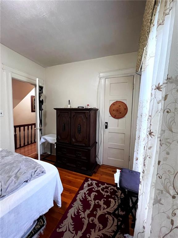 1566 E 46th St, Brooklyn, NY 11234 - bedroom featuring wood finished floors