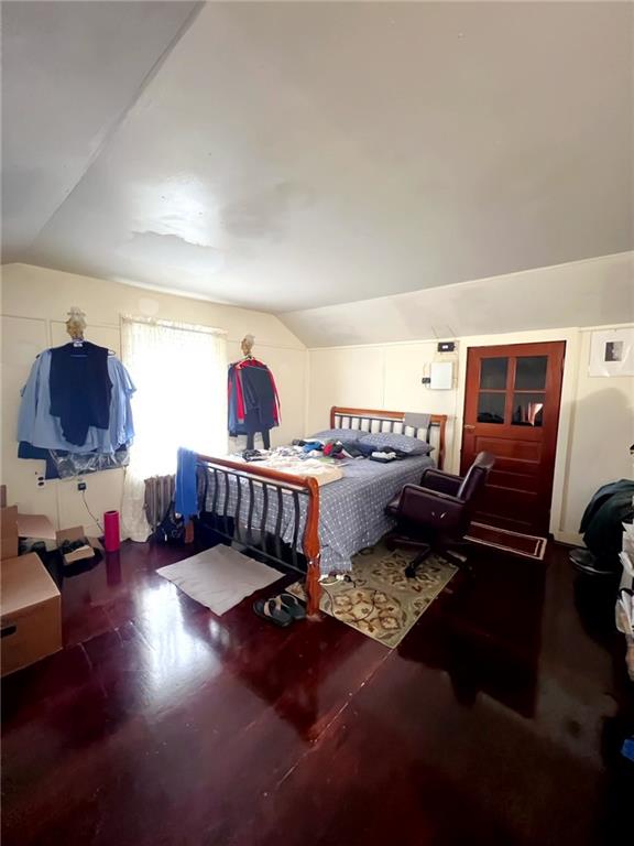 1566 E 46th St, Brooklyn, NY 11234 - bedroom featuring vaulted ceiling and wood finished floors