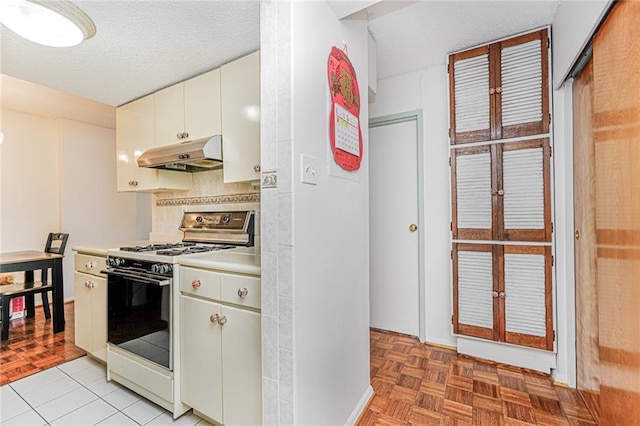 755 Narrows Rd N Unit 602, Staten Island, NY 10304 - kitchen with white range with gas cooktop, under cabinet range hood, tasteful backsplash, a textured ceiling, and light countertops