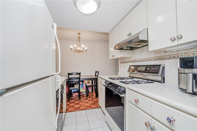 755 Narrows Rd N Unit 602, Staten Island, NY 10304 - kitchen featuring white appliances, under cabinet range hood, a chandelier, light countertops, and white cabinetry