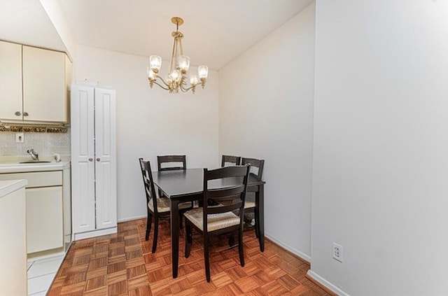 755 Narrows Rd N Unit 602, Staten Island, NY 10304 - dining space featuring a chandelier and baseboards
