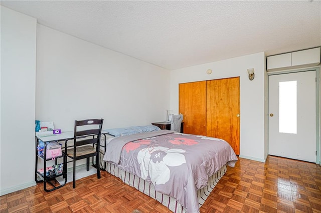 755 Narrows Rd N Unit 602, Staten Island, NY 10304 - bedroom featuring a textured ceiling and a closet
