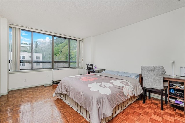 755 Narrows Rd N Unit 602, Staten Island, NY 10304 - bedroom featuring a textured ceiling and radiator