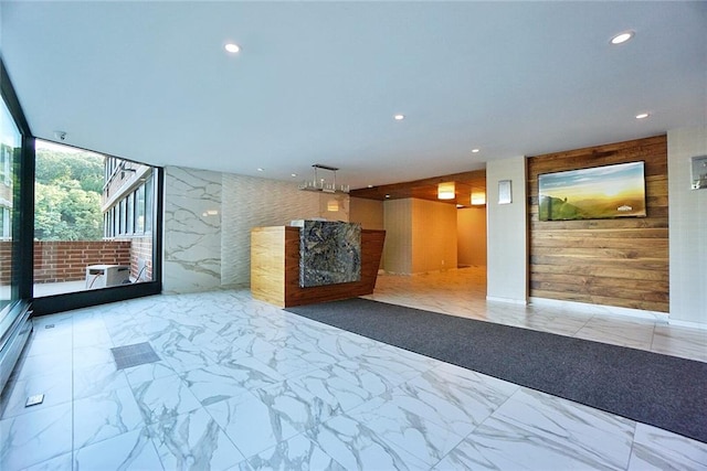 755 Narrows Rd N Unit 602, Staten Island, NY 10304 - community lobby featuring recessed lighting, expansive windows, and wooden walls